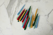 Lacquered twisted taper candles in Spruce, Sage, White, and Denim