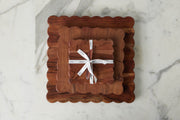 Scalloped cutting boards, scalloped wood coasters, and found silver spreaders
